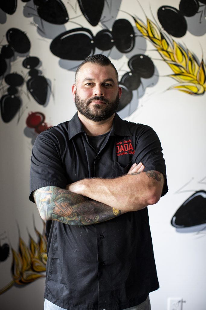 Chef Jessie Steele posing inside Dada in Delray Beach