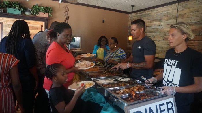 Guests in line for Sunday Dinner