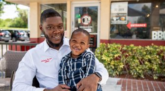 Anthony Barber at Troy's Barbeque with his son