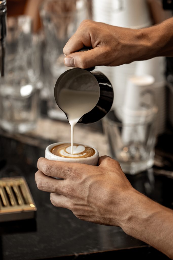 Latte Foam Pour into Coffee Mug at Composition Coffee House