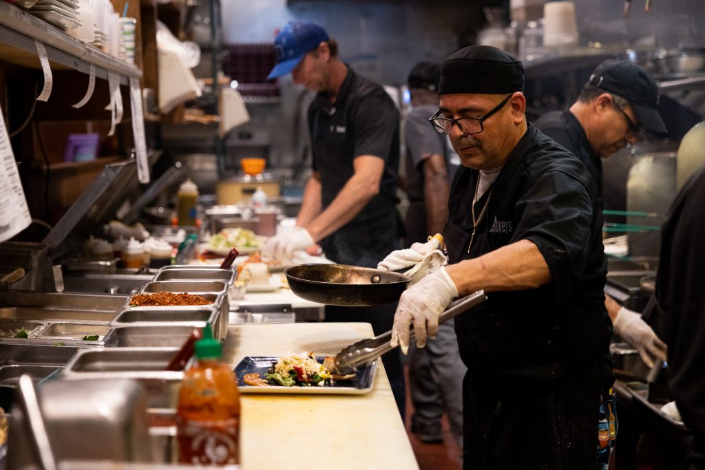 Chef preparing a seafood dish at Little Moir's Leftovers in Jupiter, Florida