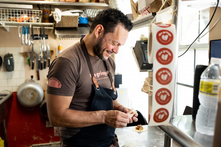 The Gringo Delray chef and owner Alan Solari Brown making empanadas.