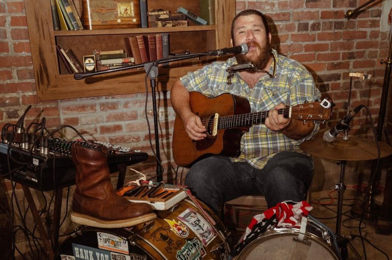 Johnny Debt performing in the listening room at Steel Tie Spirits.