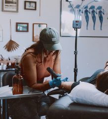 Remi Aliseo, owner of Thirdeye Studio in Jupiter, Fl., tattooing a client.