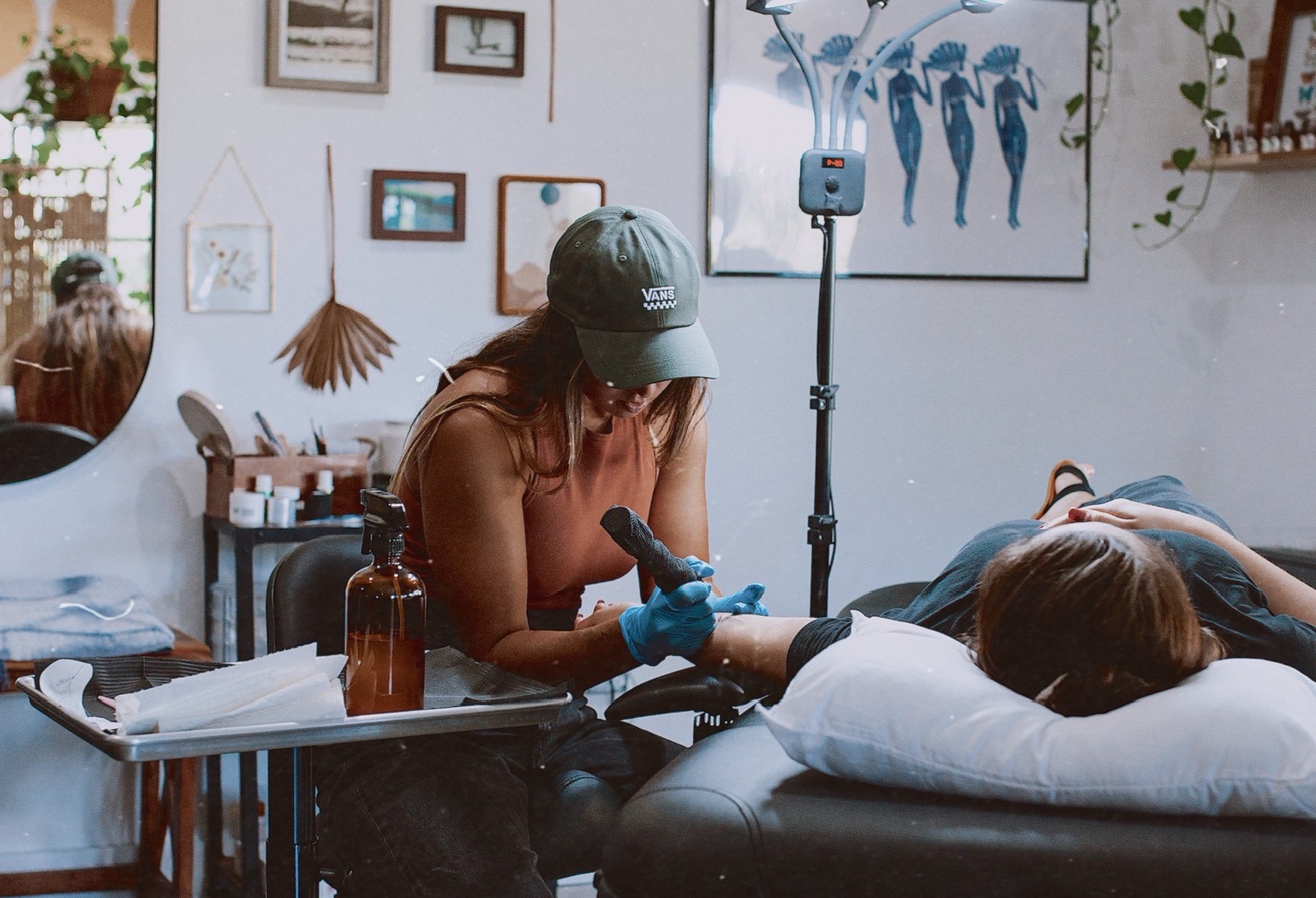Remi Aliseo, owner of Thirdeye Studio in Jupiter, Fl., tattooing a client.