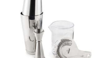 A cocktail kit that consists of a shaker, a stirring glass, a barspoon, a jigger and a strainer.