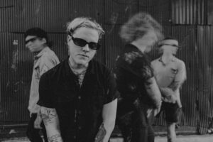 Band members of Psychic Death in a black & white portrait with motion blur.