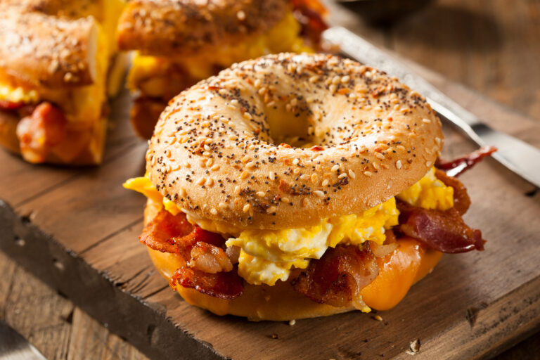 Close up of a bacon, egg and cheese sandwich on an everything bagel. For Bagels in Boca Raton feature.