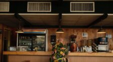 Sande's Diner in Delray Beach. Man in tropical print shirt sits at a diner counter.