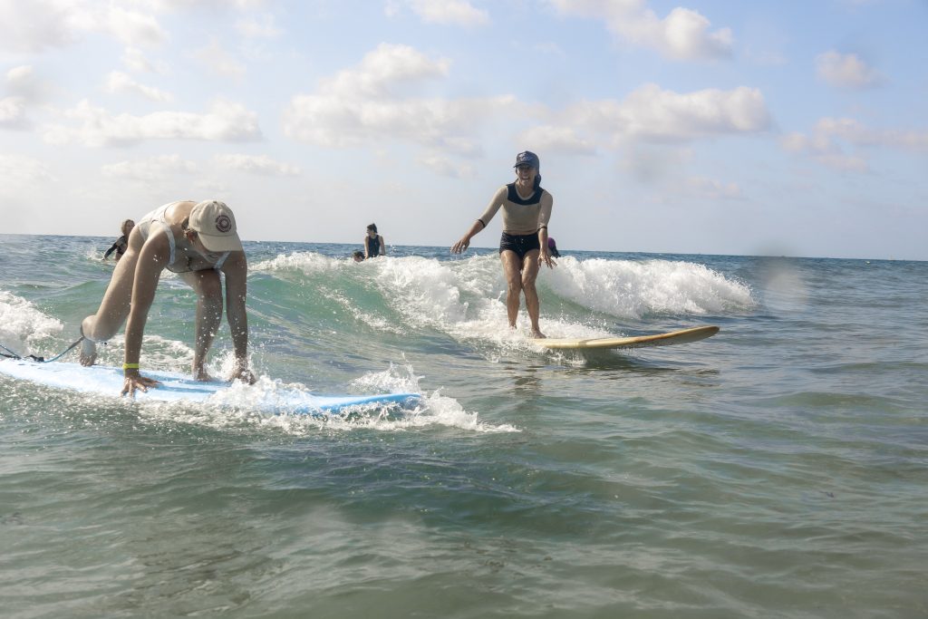 Mary Glazier, aka "Gurfer Lady," gives surf lessons