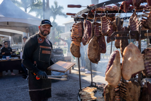 Vendor selling smoked meats at Taste of Boynton